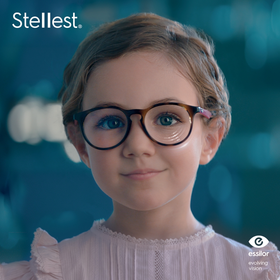 A young girl looking at the camera while wearing Stellest Lenses
